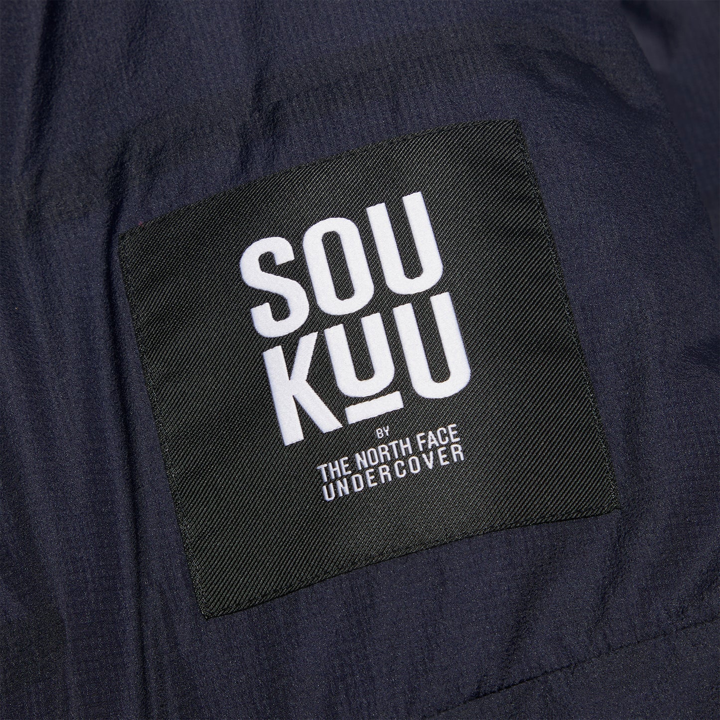 The North Face x UNDERCOVER SOUKUU Cloud Down Nupste (TNF Black/Aviator Navy)